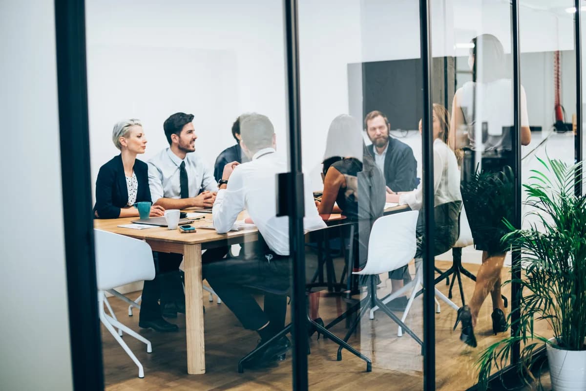 Facilitator guiding engaged team discussion